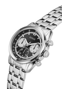 Montre en acier inoxydable argenté avec un cadran noir, fonctions chronographe, sous-cadrans texturés et bracelet à maillons poli.