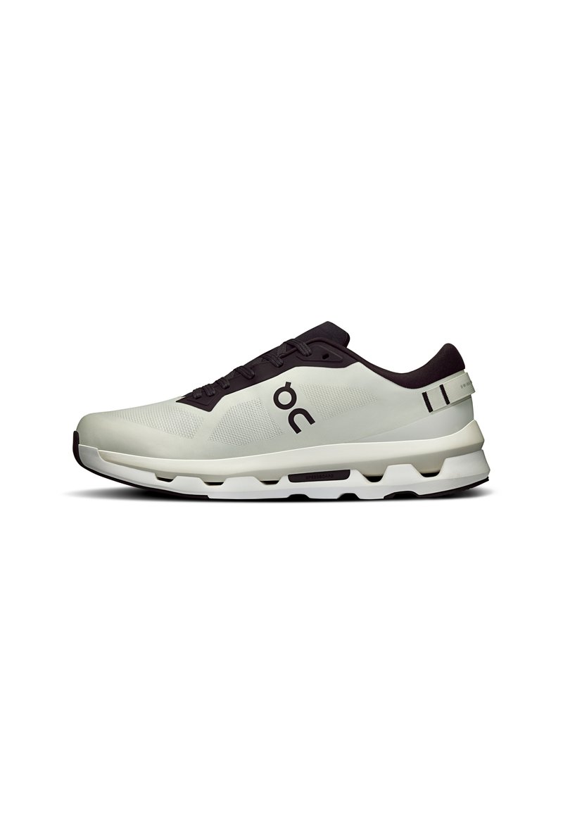 Light gray athletic shoe with a textured upper, dark gray accents, cushioned sole, and visible branding on the side. Side view.