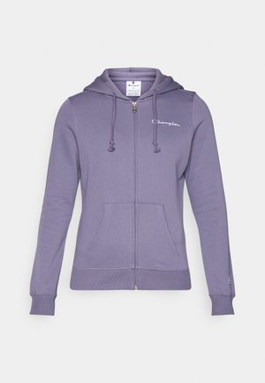 Lilla zip-up hættetrøje lavet af blød bomuldsblanding med snøre i hætten, forlommer og lille logo på brystet. Glat tekstur og tætsiddende design.