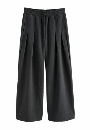 Tummanharmaat leveälahkeiset housut, joissa on joustava vyötärönauha, nyörikiristys ja etukaitaleet, valmistettu pehmeästä, teksturoidusta kankaasta.