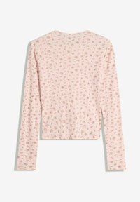 Maglietta a maniche lunghe di colore rosa chiaro a costine con piccolo motivo floreale rosa, vista da dietro su uno sfondo bianco.