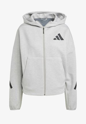 Helle graue Zip-Hoodie aus weichem Material. Verfügt über eine Kapuze, zwei Fronttaschen und schwarze Logo-Akzente auf der Brust und den Ärmeln.