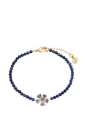 Bracelet with small round dark blue beads and a central blue enamel flower charm, gold clasp, and adjustable chain with a small gold tag.
