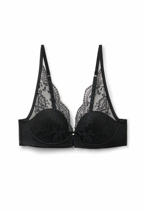 Sostén negro con copas de tela suave y un delicado encaje superpuesto, que presenta intrincados patrones florales y tirantes ajustables. Con un pequeño detalle de perla.