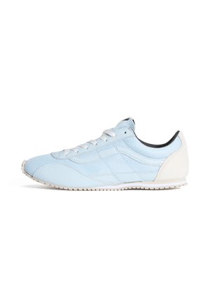 Light blue athletic shoe made of synthetic material with mesh accents, a white rubber sole, and contrasting black interior lining.