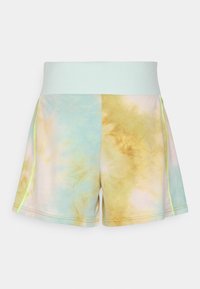 T-shirt i batikmönster med en pastellblandning av blått, gult och rosa, med en bred midja i mintgrön färg och neon-gula stygn.