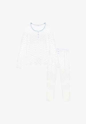 Set di pigiama bianco a maniche lunghe con piccoli pois blu, con la maglia caratterizzata da tre bottoni e bordo blu intorno allo scollo.