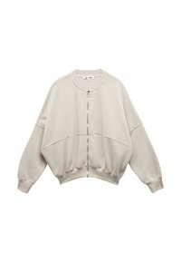 Lys beige cropped sweatshirt lavet af blødt stof, med fuld lynlås, dropped shoulders, elastiske manchetter og rund halsudskæring.