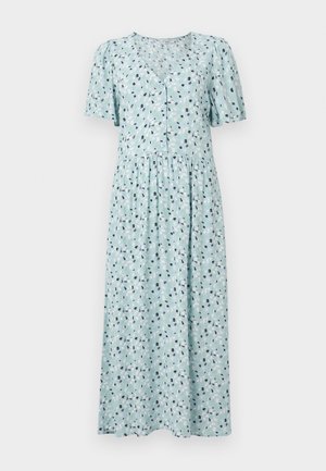 Šviesiai mėlyna suknelė su gėlių raštu, trumpomis pūstomis rankovėmis, V formos iškirpte, mygtukų užsegimu ir suknele su surinkta juosmens dalimi. Minkšta medžiagos tekstūra.