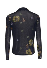 Långärmad genomskinlig blus i svart med ett blommönster som har gröna, orange och lila blommor på baksidan. Mjuk tyg med krage.