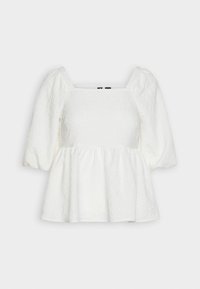 Top peplum bianco con maniche corte a palloncino, scollatura quadrata e motivo floreale testurizzato. Realizzato in tessuto leggero con una vestibilità ampia.