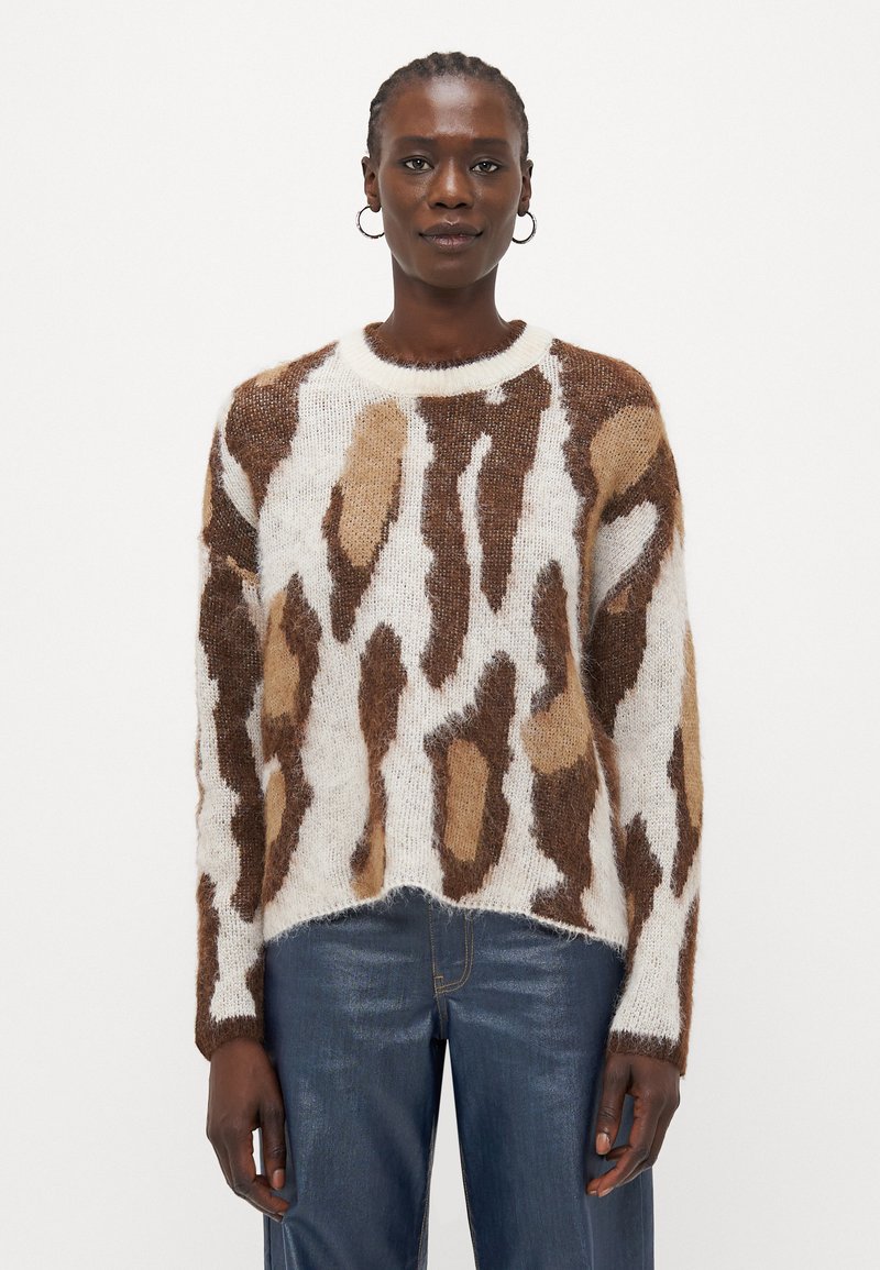 Knit sweater in soft white, brown, and tan hues with abstract pattern. Features a crew neckline and slightly cropped hem.