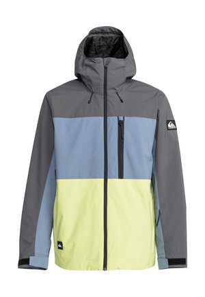 Veste en coloris gris, bleu clair et jaune. Dotée d'une capuche, d'une fermeture éclair à l'avant et de poches latérales. Matériau lisse et léger.