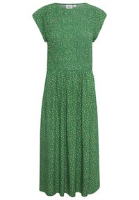 Vihreä mekko lyhyillä hihoilla, jossa on smokkihame ja virtaava hameosa. Beigen värinen pilkku-kuvio on tasaisesti jakautunut koko mekon alueelle.