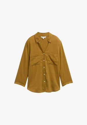 Mustár sárga gombos ing, gallérral, hosszú ujjú, és két elülső zsebbel. Könnyű, texturált anyagból készült.