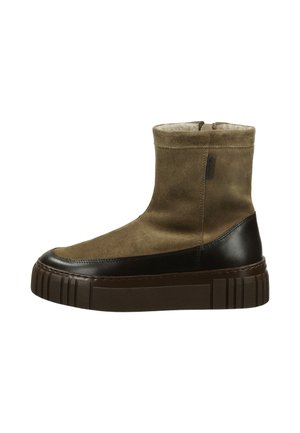 Brown suede ankle boots with a textured brown leather accent and a thick, ridged sole. Features a zip closure along the back.