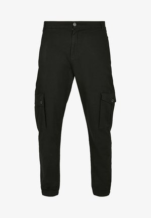 Czarne spodnie cargo wykonane z mieszanki bawełny, z bocznymi kieszeniami, guzikiem z przodu i zwężającymi się nogawkami na dole.
