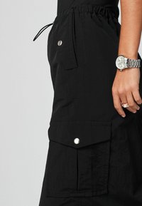Next CARGO - Maxikjol - black