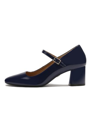 Navy patent leather Mary Jane with a pointed toe, adjustable strap, and a block heel. Smooth texture with a tan insole.