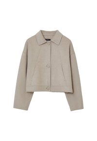 Veste beige coupée en tissu doux, dotée d'un col pointu, d'une fermeture à bouton et d'un style décontracté à coupe ample avec des accents cousus.