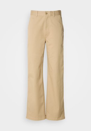Beige, wide-leg pants made from a cotton blend. Features a button closure and belt loops. Smooth texture, with minimal stitching details.
