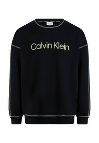 Černá mikina se střihem na volné nošení, kulatým výstřihem a kontrastním světle zeleným šitím. Logo "Calvin Klein" je výrazně umístěno ve středu.