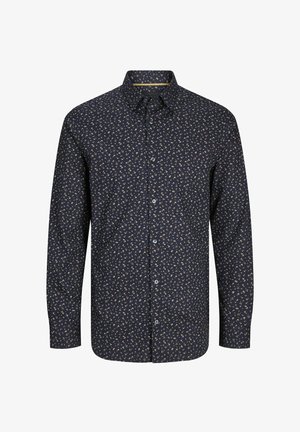 Tumesinine pikkade varrukatega särk, millel on väikene kreemivärvi lillemuster. Omab nööbiliistu ja tavalist kraed. Valmistatud kerge materjali tõttu.