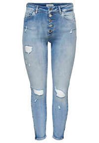 Ljusblå denim skinny jeans med hög midja, med knappgylft, slitna detaljer och flera revor med blottat vitt tyg.