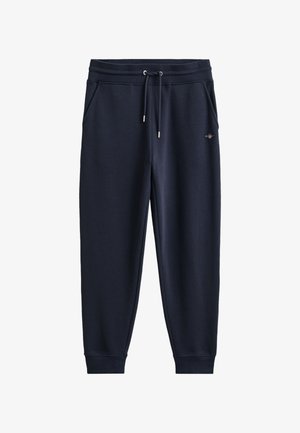 Marineblå joggebukser med ribbestrikket midjebånd og mansjetter, snøring, sidelommer og liten brodert logo på øvre lår.