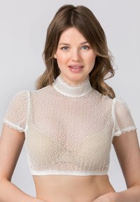 Weißes Spitzen-Crop-Top mit kurzen Ärmeln, hohem Kragen, Blumenmuster und gewellten Kanten, das eine durchsichtige und zarte Textur zeigt.