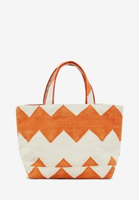 Vászontáska narancssárga és fehér zig-zag mintával, két erős fogantyúval és merev formával. Textúrált szövetfelszín.