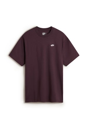 T-shirt in cotone color marrone con collo rotondo e maniche corte. Presenta un piccolo logo bianco sul lato sinistro del petto. Tessuto liscio. Vestibilità regolare.