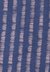 Knitted fabric featuring vertical lines in pink on a blue background, with a textured finish and uneven width patterns throughout.