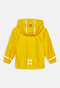 Yellow rain jacket with a hood, featuring white reflective stripes on sleeves, and a pattern of four white dots on the back. Smooth texture.