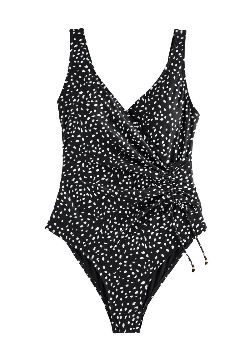 Fekete egyrészes fürdőruha fehér pöttyös mintával, átkötős dizájnnal, állítható oldalsó megkötőkkel és széles vállpántokkal.