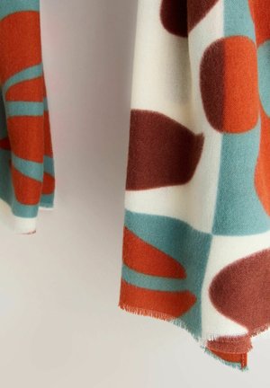 Villasegu segust tekk, millel on abstraktsed kujundid roostes, türkiissinises ja koores. Pehme tekstuur ja narmastega servad. Sobib hästi kihiliseks kasutamiseks või drapeerimiseks.