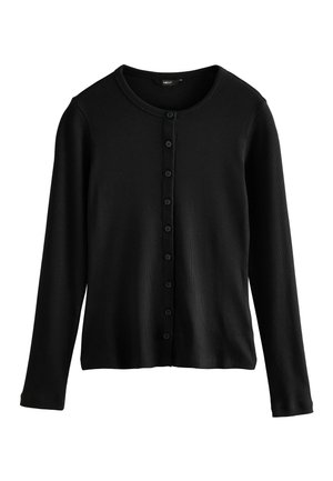 Musta neulecardigan pitkillä hihoilla, pyöreällä kauluksella ja edessä napituksella, jossa useita pieniä mustia nappeja nappilistan varrella.