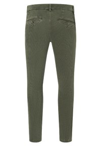 Olive green skinny pants in cotton blend. Features five-pocket design, subtle texture, and contrasting stitching. Mid-rise waist, no embellishments.