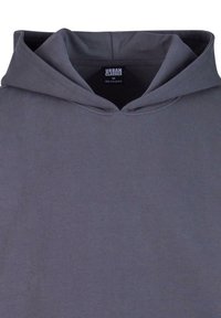 Hoodie grigia in cotone con cappuccio regolabile, una texture morbida e una tasca a kangaroo frontale. Etichetta con scritto "URBAN CLASSICS," taglia M.