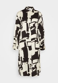 Rochie cămașă alb-negru cu pattern-uri abstracte din pensule, mâneci lungi, guler și o siluetă dreaptă.