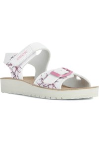 Sandalias blancas con patrón floral, hebilla ajustable rosa y plantilla suave. Presenta una suela gruesa y texturizada para mayor estabilidad.