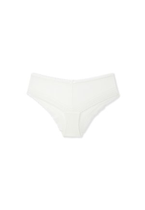 Slip bianco in cotone con bordo in pizzo in vita e alle aperture delle gambe. Texture liscia con un delizioso fiocco al centro dietro.