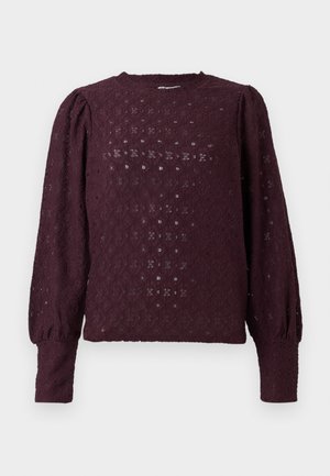Long-sleeve dark purple lace blouse with puffed shoulders and fitted cuffs, featuring a diamond and floral pattern.