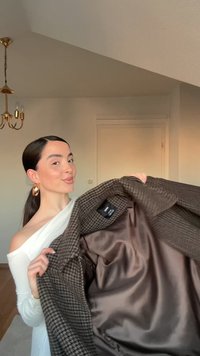 Brown and black houndstooth patterned blazer with satin lining, showcasing a classic notch lapel and spacious interior pocket.