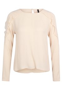 Top lungo beige chiaro a maniche lunghe con dettagli in ruffle sulle spalle, scollatura rotonda e chiusura con bottone sul retro, realizzato in materiale morbido.