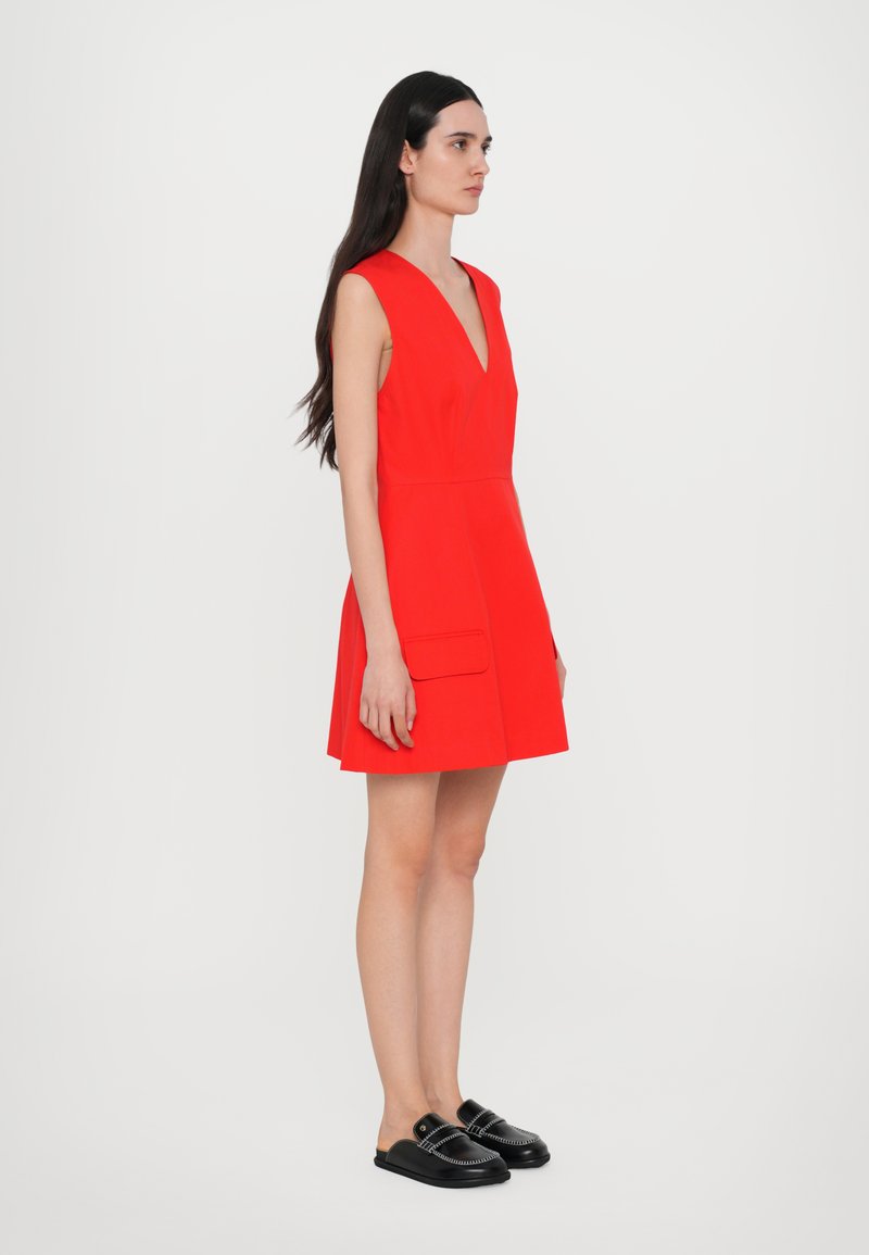 strapless open back dress Dramatic red organza dress adorned with Milla's signature and black gl