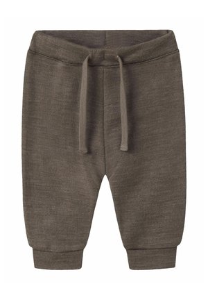 Grå joggingbukser lavet af blødt stof, med elastisk linning med snøre og tilspidsede manchetter ved anklerne.