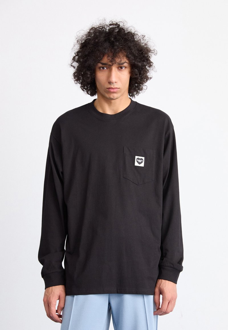 Black long-sleeve t-shirt made of cotton, featuring a chest pocket with a square logo. The design is relaxed-fit with a round neckline.