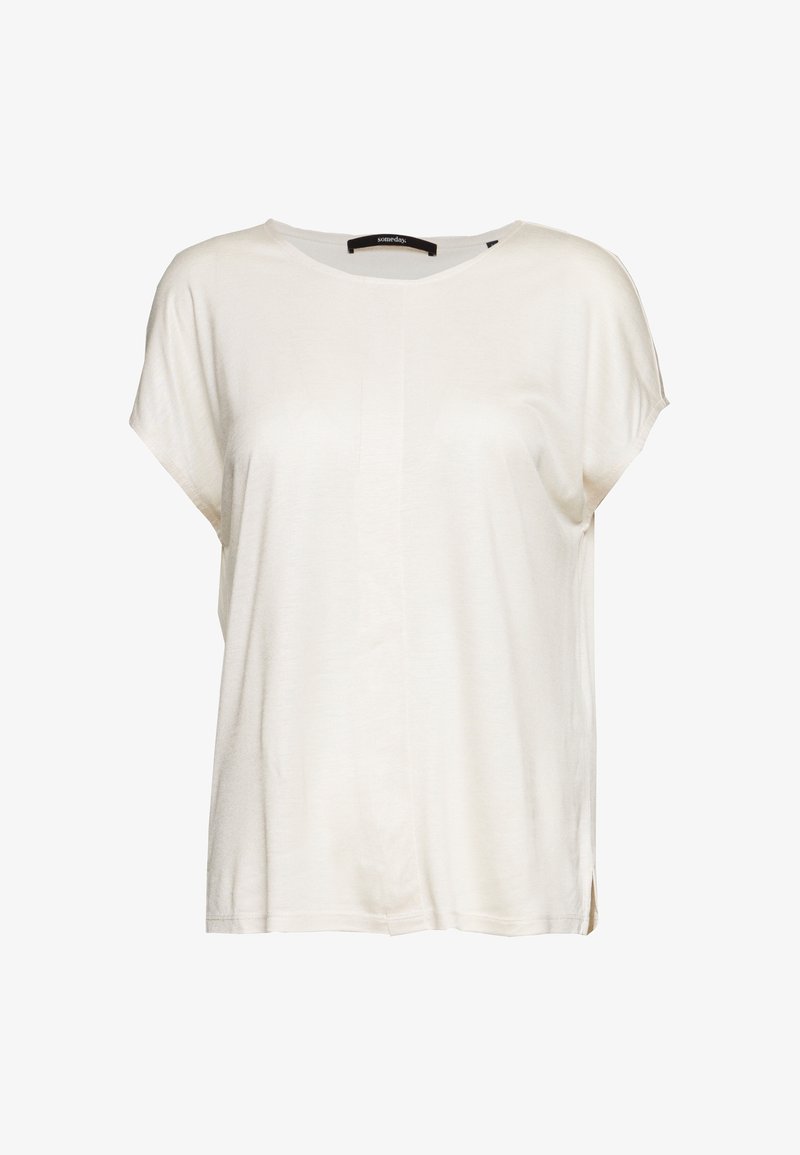 Haut blanc léger à manches courtes avec une coupe ample, décolleté légèrement arrondi et fentes sur les côtés pour faciliter les mouvements. Texture lisse.