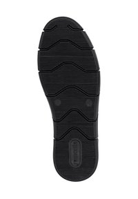 Semelle de chaussure en caoutchouc noir avec des motifs texturés, présentant un design en zigzag et des accents circulaires, offrant adhérence et durabilité.